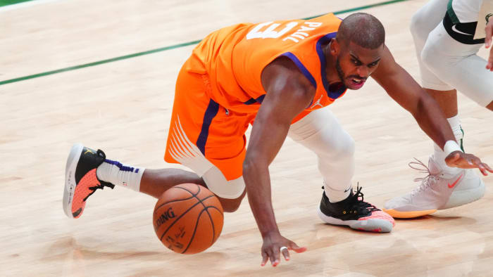 Phoenix Suns point guard Chris Paul turns the ball over.
